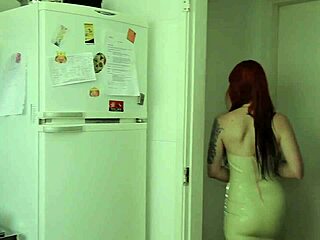 Lesbian redheads indulge in sensual fingering and pussy play on a couch
