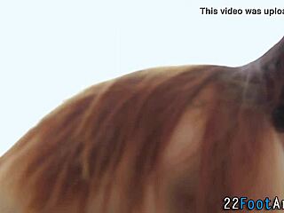 Gorgeous woman performs a sensual foot massage