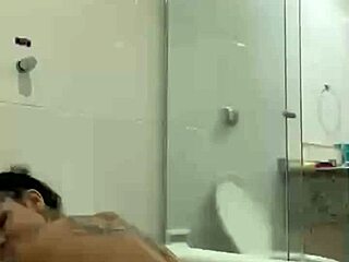 i'm bia hot brunette relaxing with the shower jet in the bath