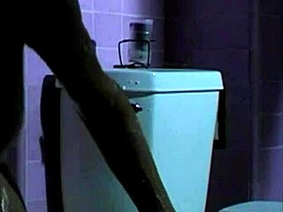 A woman with blonde hair undresses and gets a bath and we see her naked body.