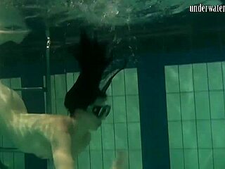 Brunette teen kristina andreeva swims naked in the pool