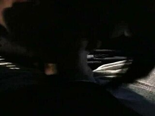 A real hooker performs a blowjob in a car outdoors.