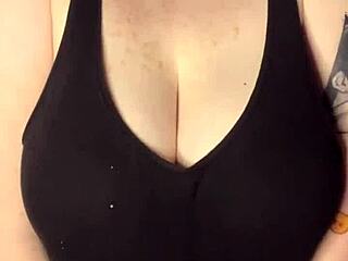 Model slaps huge tits on desk