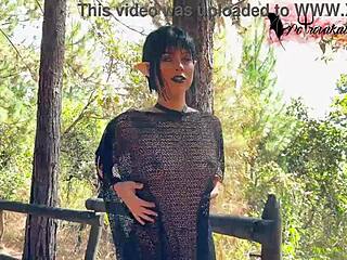 Gothic elf teen masturbating solo with tattoos in a mysterious forest setting.