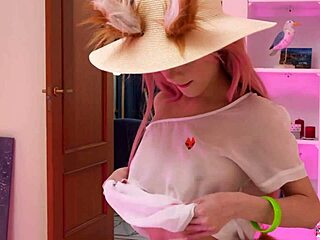 naked baby doll plays with dildo in front of camera