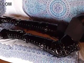 Total black outfit with fishnets pantyhose and boots over the knee!