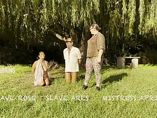 At the beach, amazonian ebony goddesses in corsets and boots dominate with spanking and foot play in a wild group comeback.